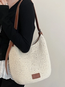 Fashionable beige woven cotton bucket bag with brown leather strap for summer