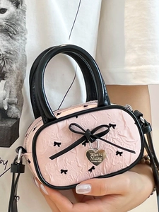 Sac à main plissé rose avec nœuds noirs et pendentif en cœur pour femmes chic