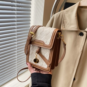 Mini vintage crossbody bag in beige and brown with quilted pattern and round logo