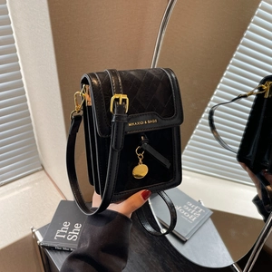 Elegant black crossbody cell phone bag with quilted texture and gold hardware detailing