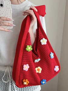 Handmade red crochet tote bag with colorful floral patterns and large capacity style