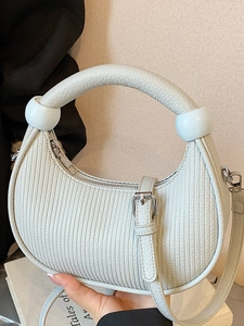 Fashionable light blue pleated crescent handbag with unique beaded handle and silver zipper