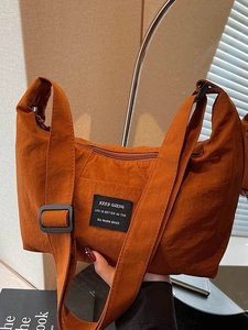 Retro caramel nylon tote bag with wide shoulder strap and woven logo label for women
