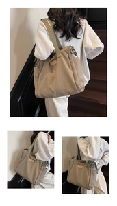 Detailed view of a large canvas tote bag with olive green straps and side drawstring pockets