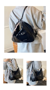 Detailansicht der schwarzen PU-Ledertasche mit Kroko-Tasche und Silberschnallen