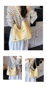 Detailansicht der cremefarbenen Hobo-Tasche mit Reißverschluss und Vordertasche