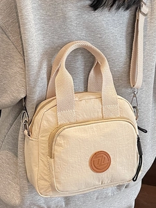 Fashionable beige nylon small square crossbody handbag with front zipper and logo patch