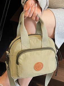 Fashionable light green nylon crossbody handbag for women with adjustable shoulder strap