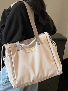 Minimalist large capacity canvas tote bag with comfortable wide shoulder straps