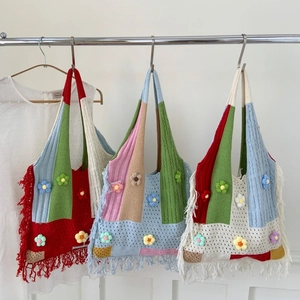 Handmade crochet knit tote bag with tassel fringe and 3D floral accents in retro style