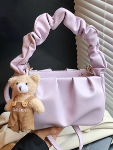Fashionable lavender pleated cloud bag with chain strap and cute bear plush charm accessory