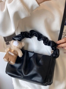 Fashionable black pleated cloud shoulder bag with a cute plush bear pendant accessory