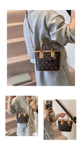 Detailed view of the bear pattern texture and golden hardware on the brown bucket bag