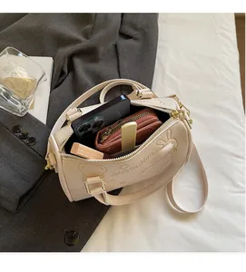 Internal view of pink Boston bag showing capacity for phone, wallet and cosmetics