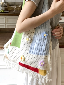 Retro handmade crochet tote bag with colorful patchwork patterns and white tassels
