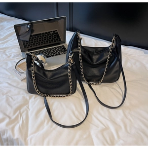 Detailed comparison of large and small black lychee grain leather hobo bags with gold chains
