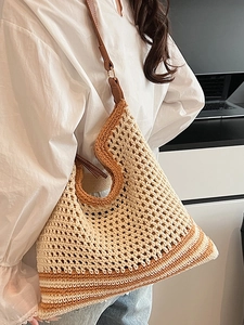 Handmade crochet tote bag with contrast mesh texture and brown leather straps
