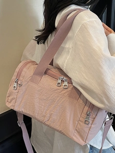 Pink waterproof nylon fitness travel bag with large capacity and shoulder straps