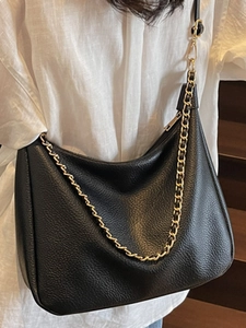 Black lychee leather crescent shoulder bag with golden chain strap for women