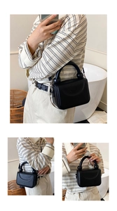 Detail view of black pebble leather crossbody bag with unique beaded handle