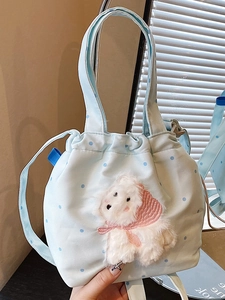 Borsa tote blu a pois con coulisse, simpatico cucciolo di peluche 3D e tracolla lunga