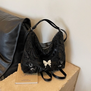 Versatile black PU leather backpack with marble texture and white butterfly charm detail