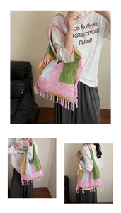 Detail of bohemian knit tote bag showing multi-color patch design and long fringe tassels