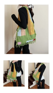 Detail of bohemian knitted tote bag with multi-color patchwork and fringe edges