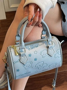 Light blue Boston handbag with embossed bear pattern and adjustable shoulder strap