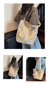 Detail of beige nylon tote bag with small round coin purse and white brand label