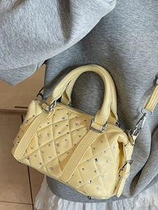Pale yellow quilted mini handbag with sparkling rhinestones and silver hardware straps