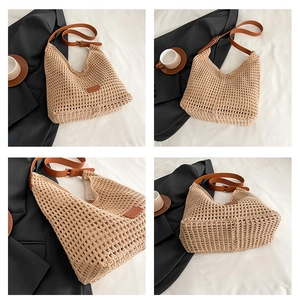 Detail view of woven straw tote bag with brown leather straps and metal buckle