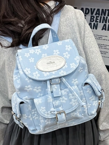 Sac à dos bleu clair à motif floral blanc avec rabat magnétique pour femmes