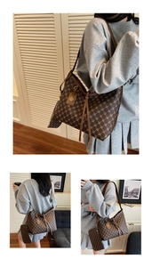 Macro detail of retro monogram tote bag with gold clover logo and leather strap decoration