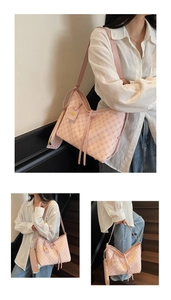 Pink monogram tote bag set with matching pouch and stylish tassel details for daily commute