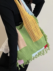 Colorful crochet tote bag with fringe trim and hollow knit design for bohemian style