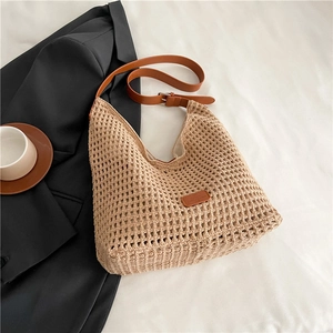 Detailed macro view of woven beige texture and brown leather strap with metal buckle