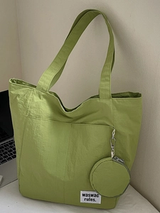 Waterproof nylon tote bag in grass green with matching round coin purse for women