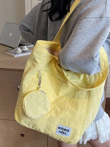Bright yellow waterproof nylon tote bag with large capacity and matching coin purse
