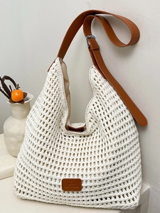White hand-woven crochet tote bag with brown leather strap and large capacity design