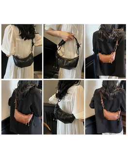 Detail shots of minimalist croissant shoulder bags in black and brown leather texture