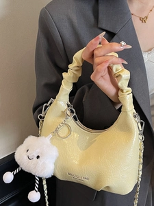 Chic pale yellow ruched handbag with metal chain strap and white cloud charm accessory