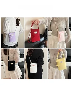 Detail view showing six color options of mini crossbody phone bags with pearl accents
