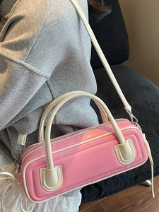 Chic pink boston shoulder bag with contrast white handles and adjustable strap