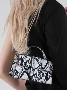 Black and white snakeskin pattern small square bag with decorative gold bead chain strap