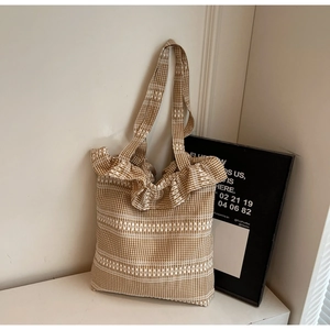 Detail of Korean style tote bag featuring brown gingham pattern and white ruffle edge