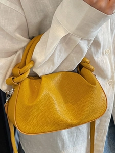 Fashionable bright yellow lychee leather dumpling bag with knotted handle for women