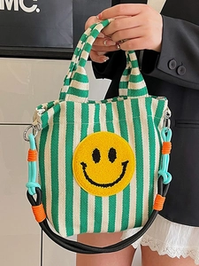 Sac fourre-tout en tricot rayé avec broderie smiley jaune et poignée en corde colorée