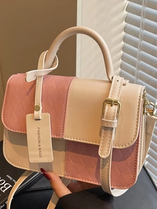 Pink and beige contrast shoulder bag with quilted pattern and round top handles