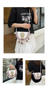 Detailed close-up of Bohemian woven shoulder bag featuring purple tassels and bead details